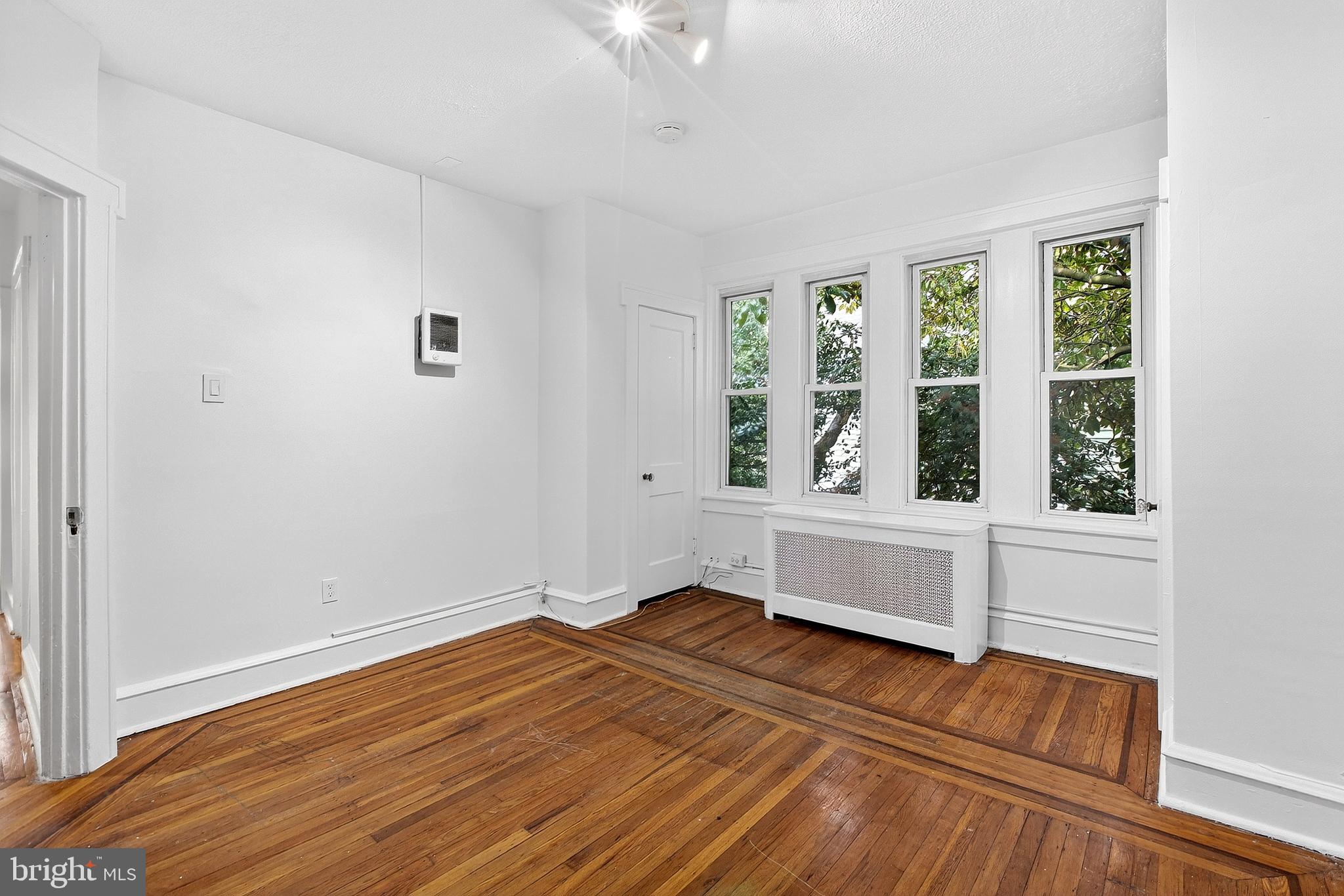 412 West Maple Avenue Merchantville, NJ 08109 - Photo 44 of 58 a view of empty room with wooden floor and fan
