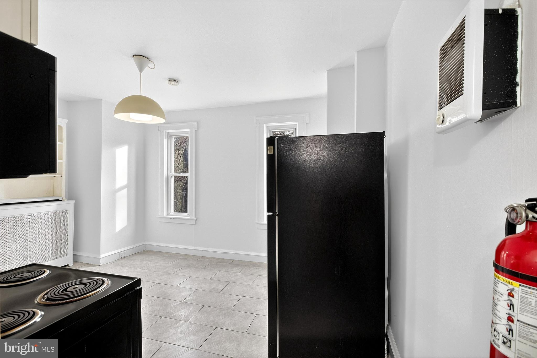412 West Maple Avenue Merchantville, NJ 08109 - Photo 48 of 58 a kitchen with a refrigerator and a stove top oven
