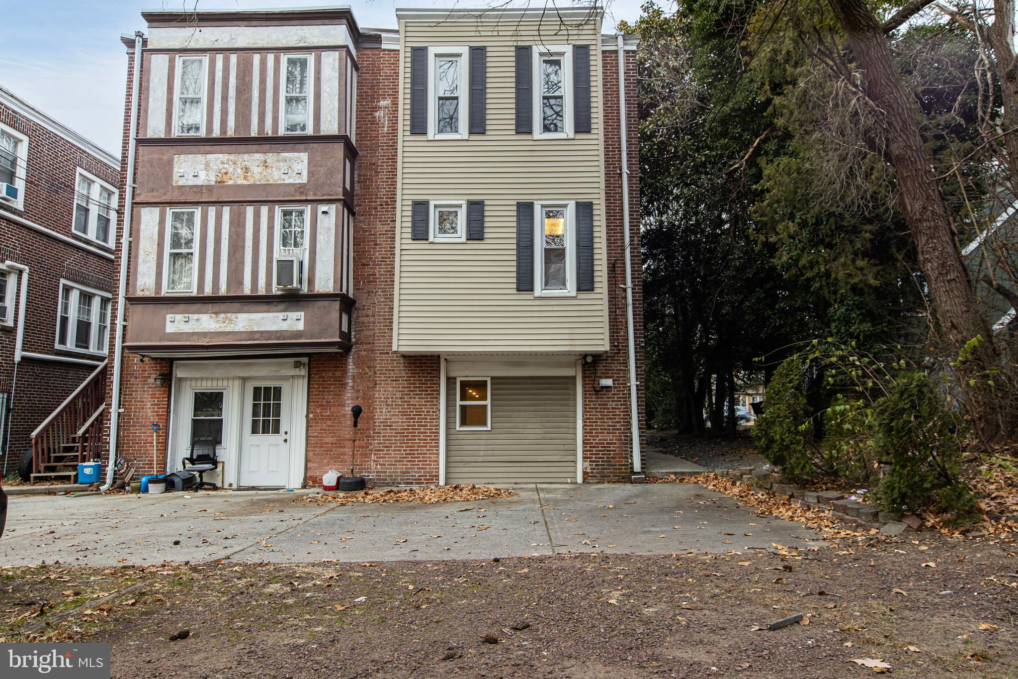 412 West Maple Avenue Merchantville, NJ 08109 - Photo 55 of 58 a front view of a house with a yard and parking space
