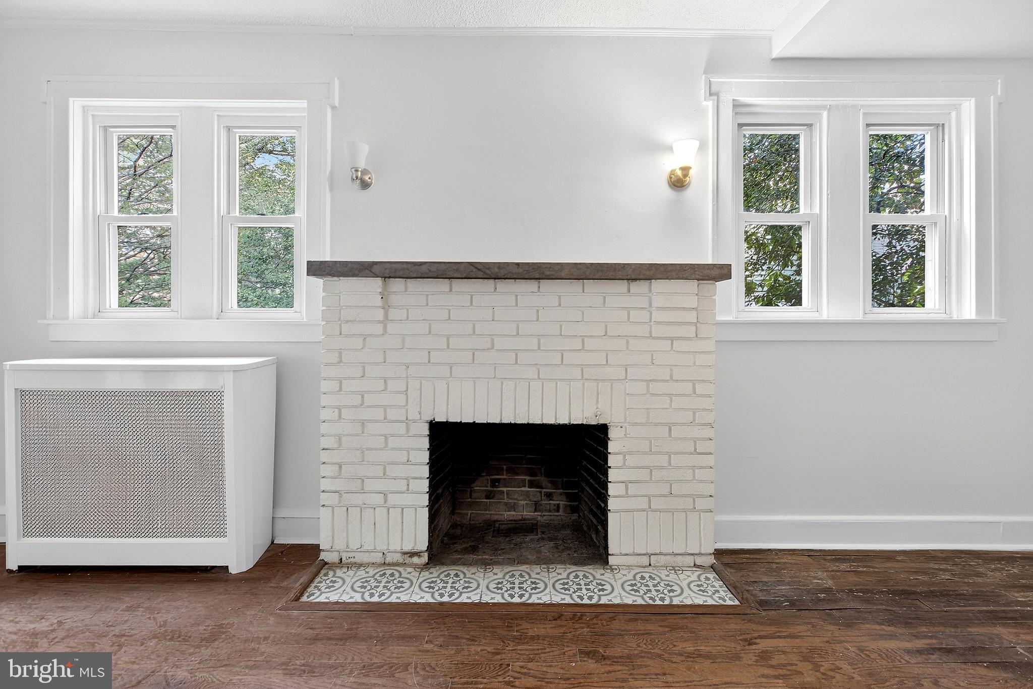 412 West Maple Avenue Merchantville, NJ 08109 - Photo 6 of 58 a living room with a fireplace and windows