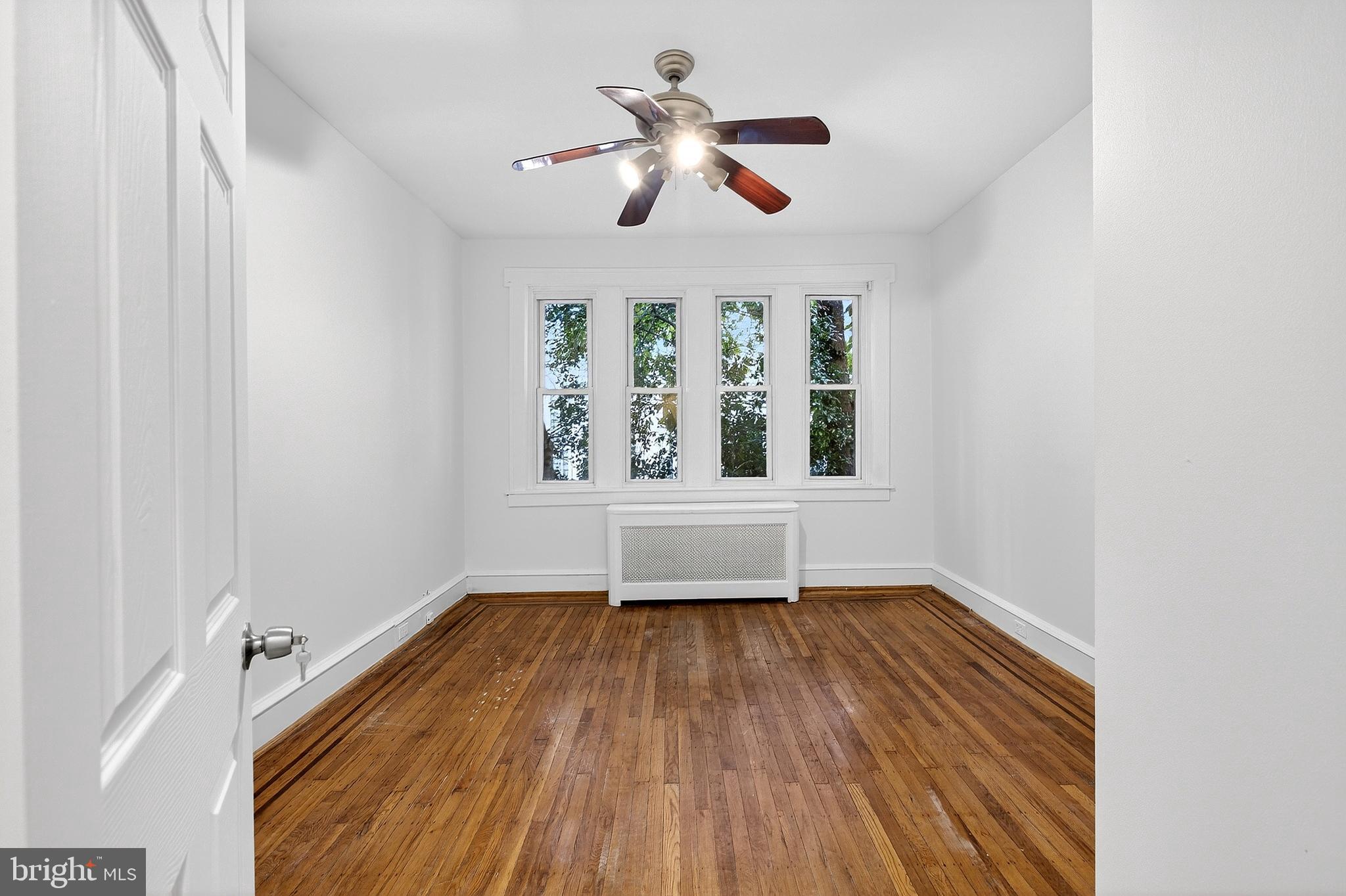 412 West Maple Avenue Merchantville, NJ 08109 - Photo 8 of 58 a view of empty room with wooden floor and fan