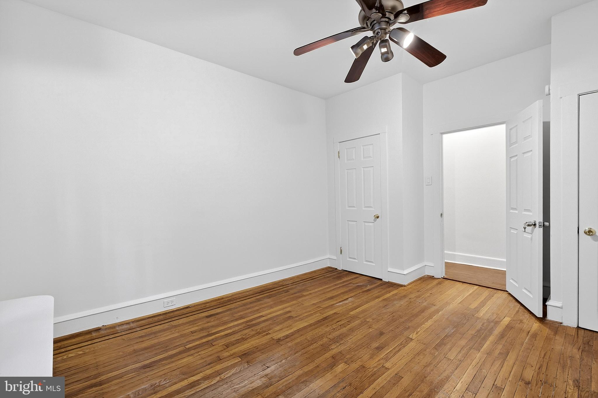 412 West Maple Avenue Merchantville, NJ 08109 - Photo 9 of 58 a view of a room with wooden floor and ceiling fan