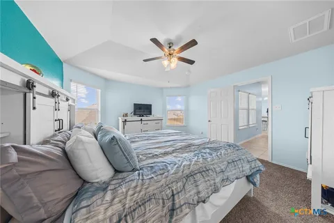 a bathroom with a sink a mirror and a shower
