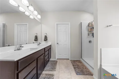 a bathroom with a bathtub and a sink