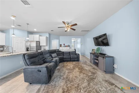 a kitchen with cabinets and window