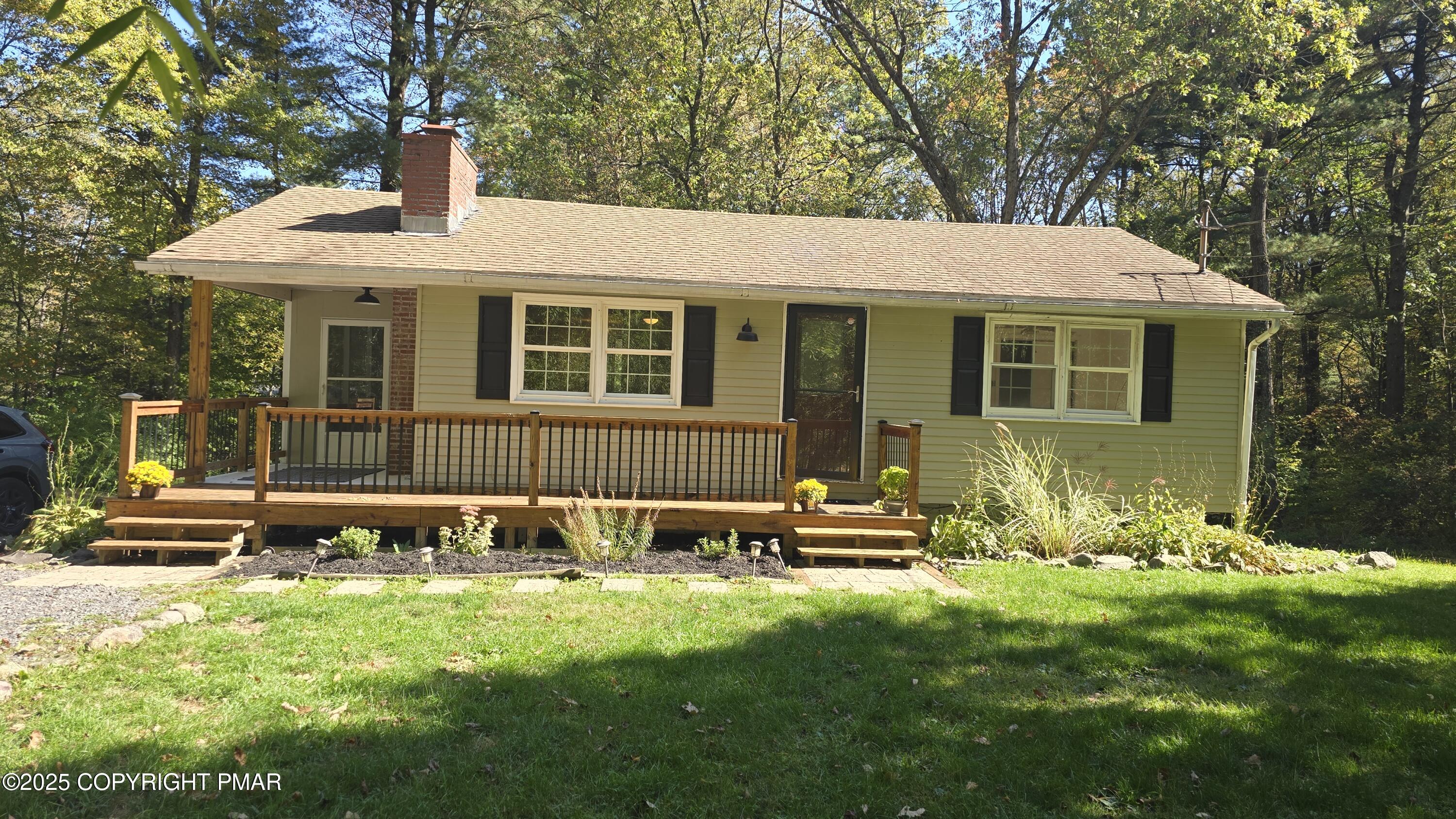 5550 Springhouse Lane Kunkletown, PA 18058 - Photo 1 of 41 a front view of a house with garden