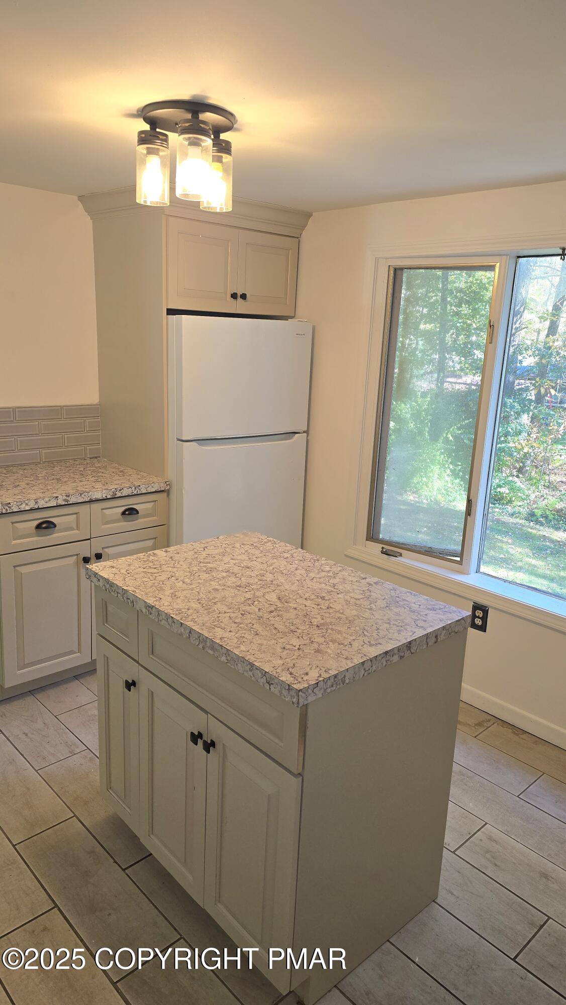 5550 Springhouse Lane Kunkletown, PA 18058 - Photo 13 of 41 a room with a sink cabinets and window
