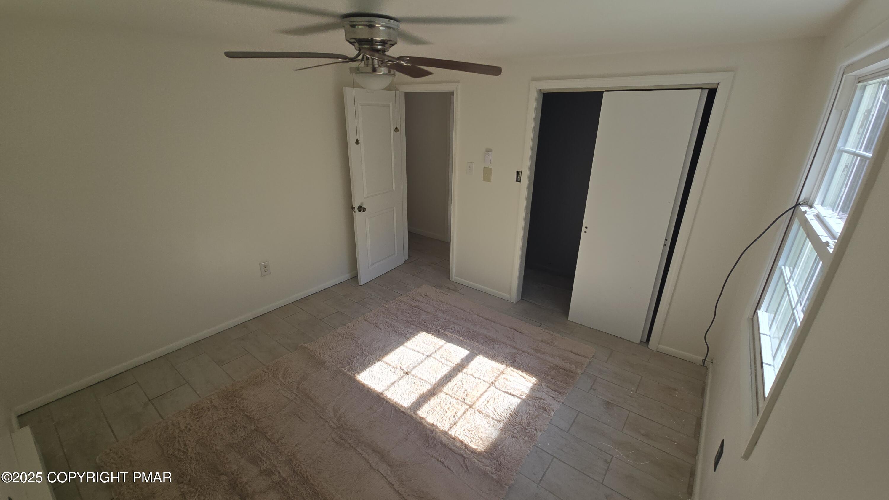 5550 Springhouse Lane Kunkletown, PA 18058 - Photo 24 of 41 a view of empty room with windows