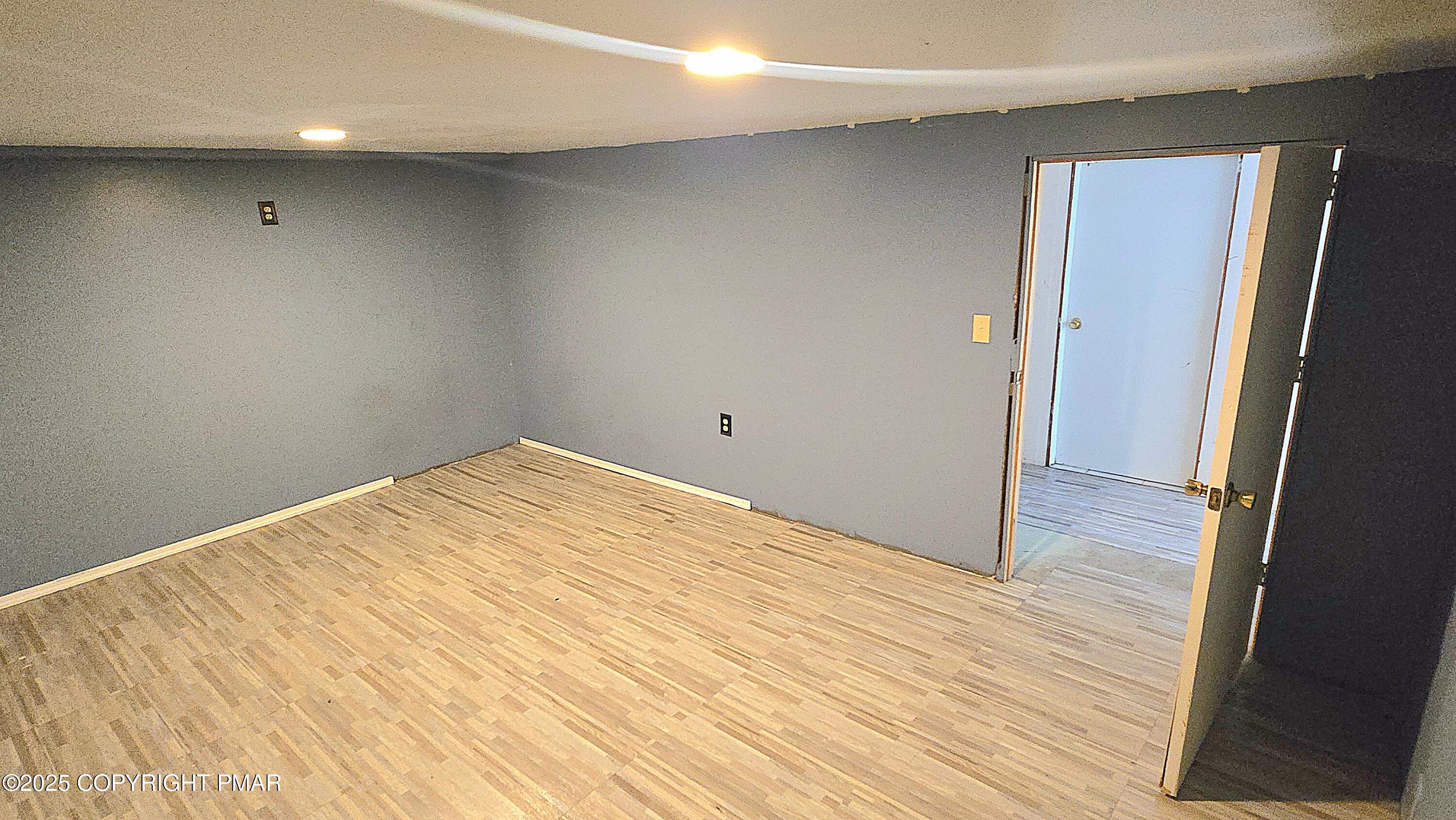 5550 Springhouse Lane Kunkletown, PA 18058 - Photo 28 of 41 a view of empty room with wooden floor