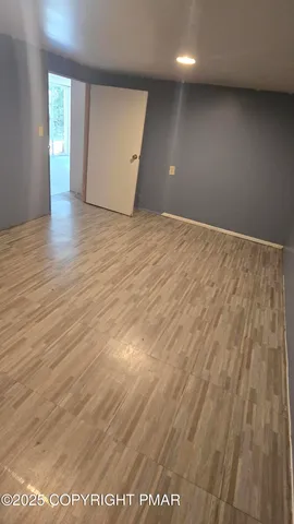 a view of a house with a big yard and sitting area