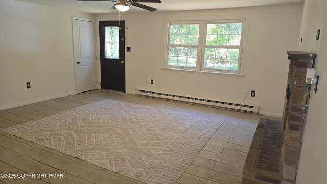 a view of an empty room with a window