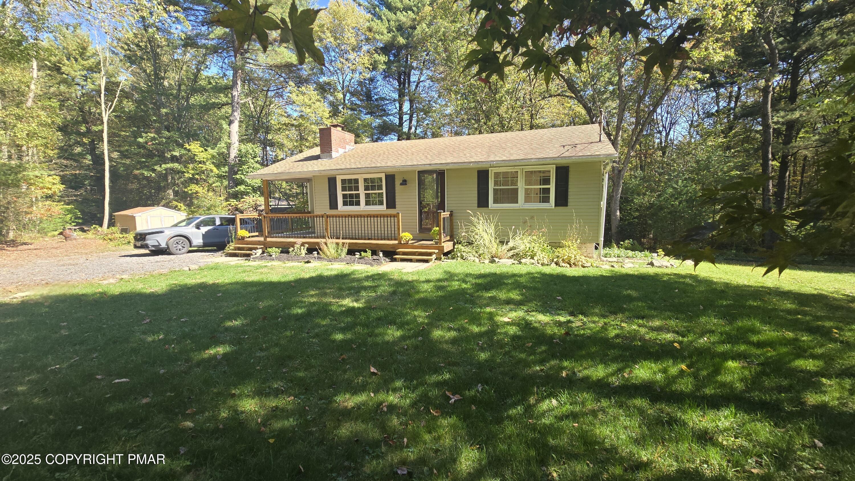 5550 Springhouse Lane Kunkletown, PA 18058 - Photo 31 of 41 a view of a house with a big yard and sitting area