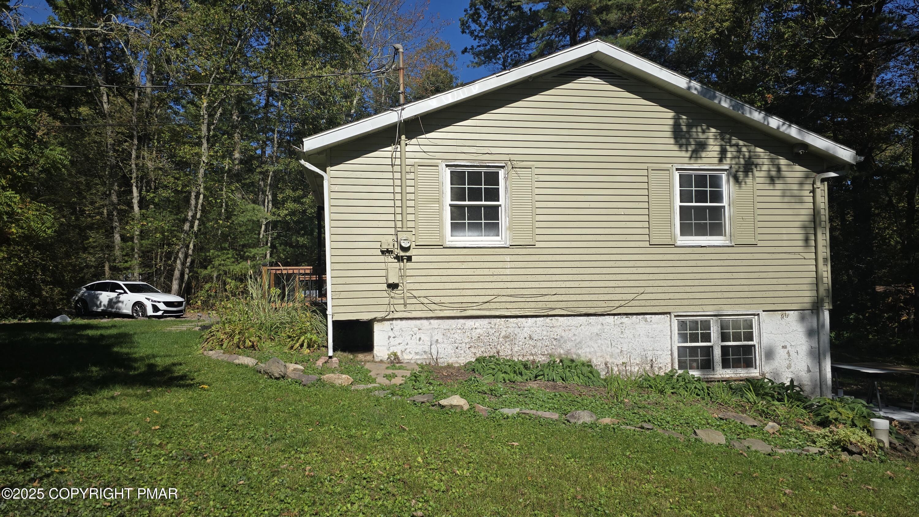 5550 Springhouse Lane Kunkletown, PA 18058 - Photo 33 of 41 a view of a house with a yard plants and large tree