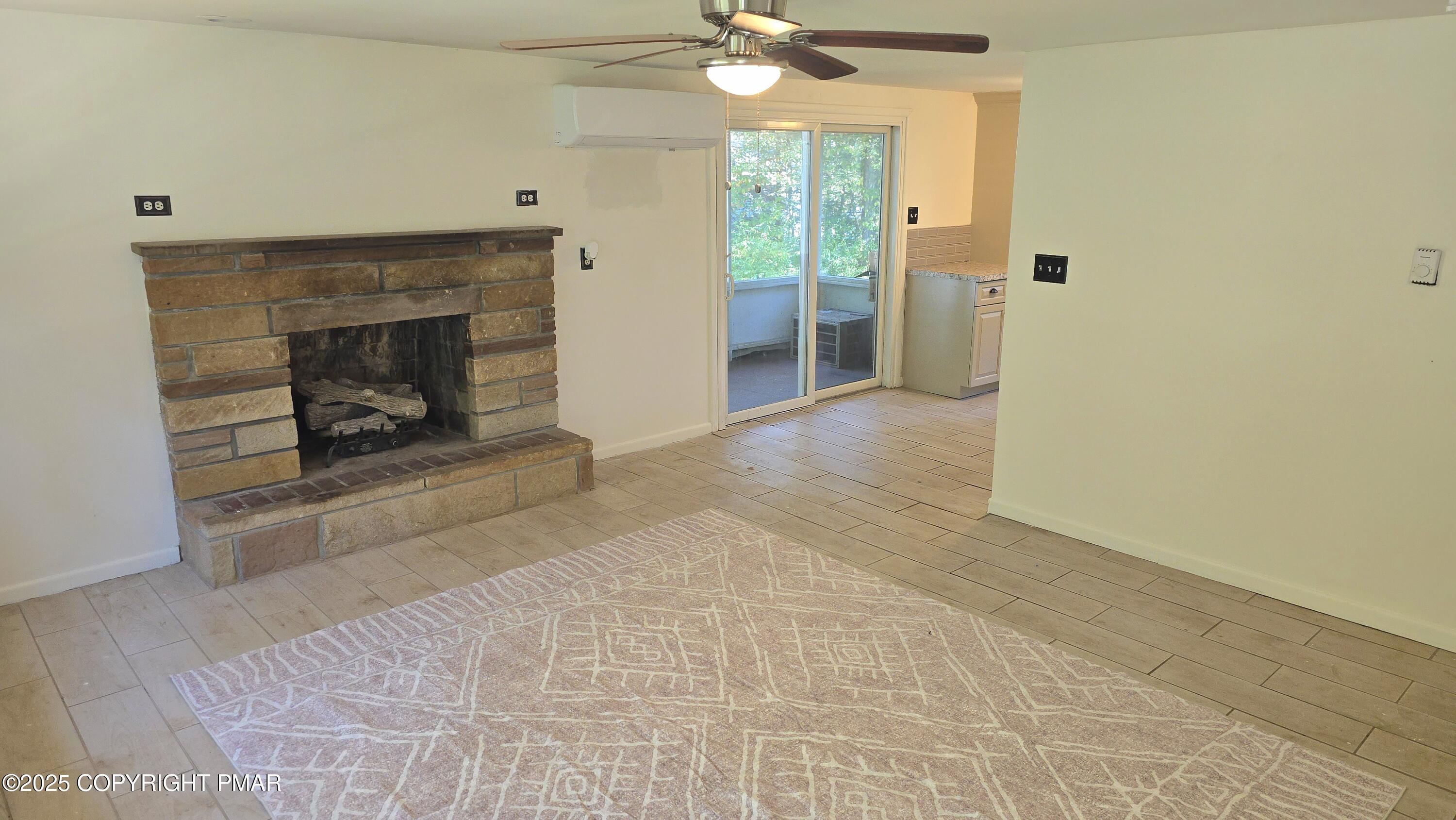 5550 Springhouse Lane Kunkletown, PA 18058 - Photo 6 of 41 a view of an empty room with a fireplace