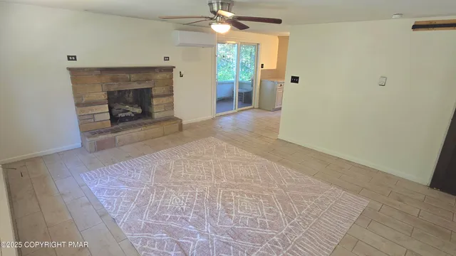 a view of a livingroom with a fireplace