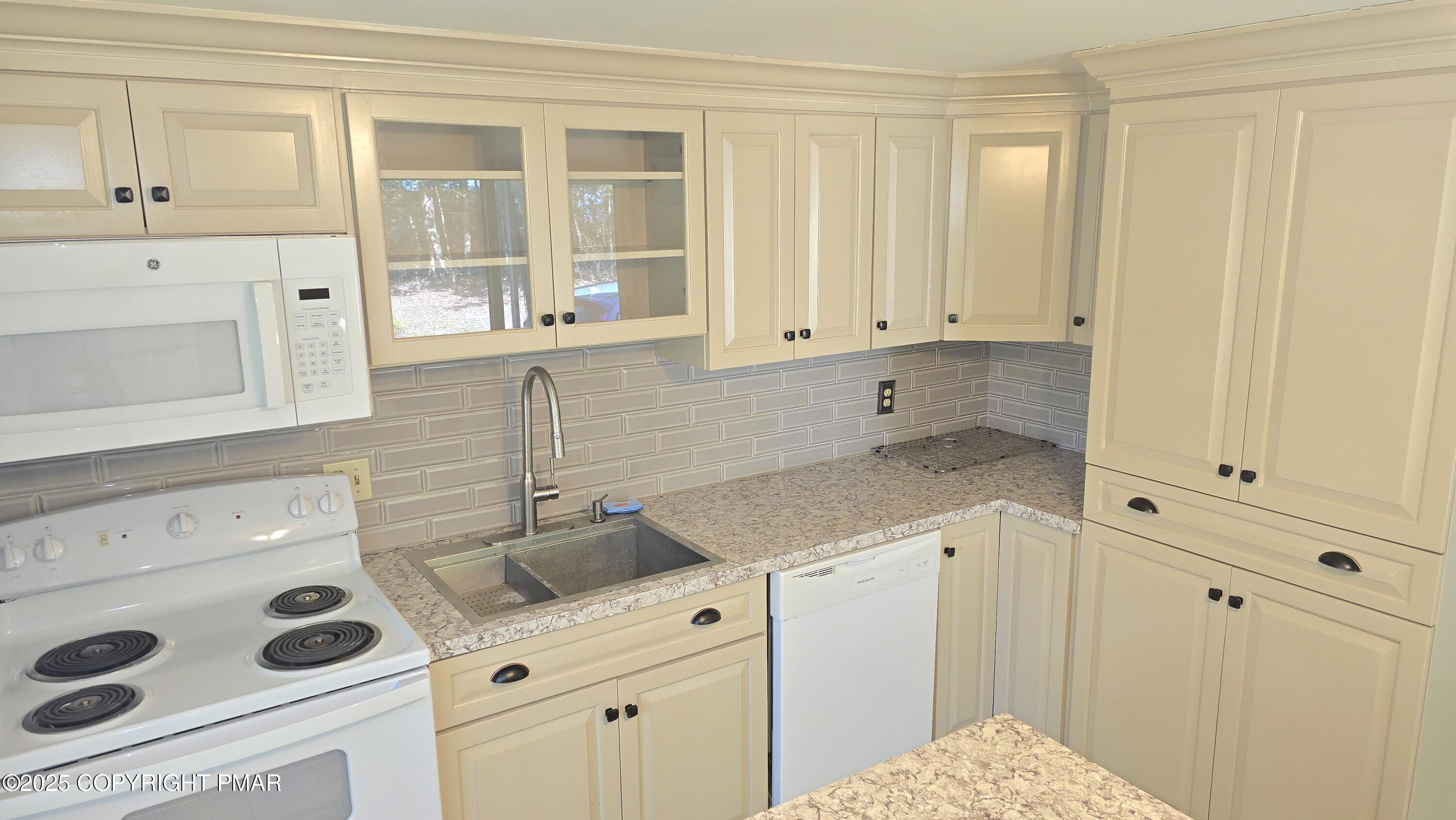5550 Springhouse Lane Kunkletown, PA 18058 - Photo 10 of 41 a kitchen with white cabinets and sink