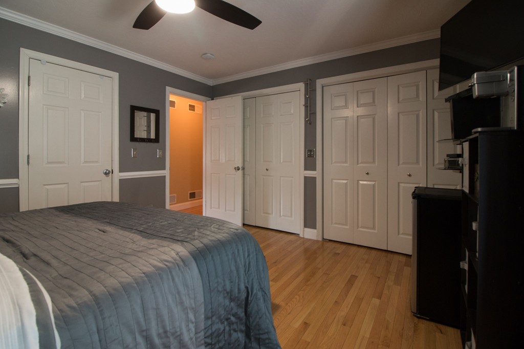 152 Carter Street Fall River, MA 02721 - Photo 16 of 30 a spacious bedroom with a bed and a chandelier