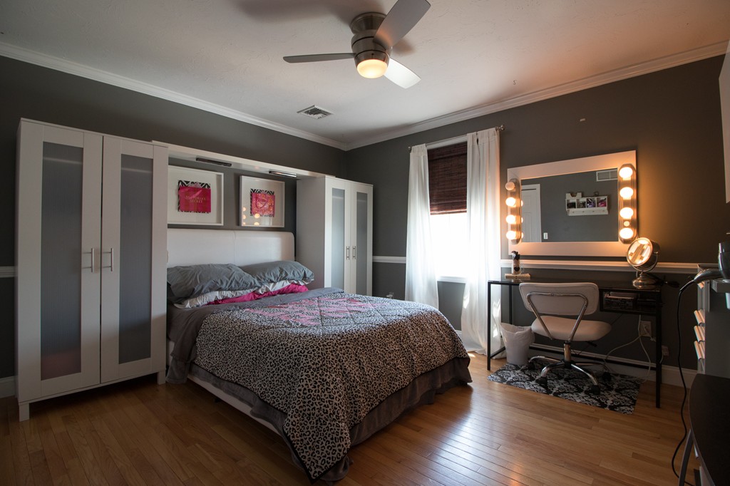 152 Carter Street Fall River, MA 02721 - Photo 17 of 30 a bedroom with a bed and a chandelier