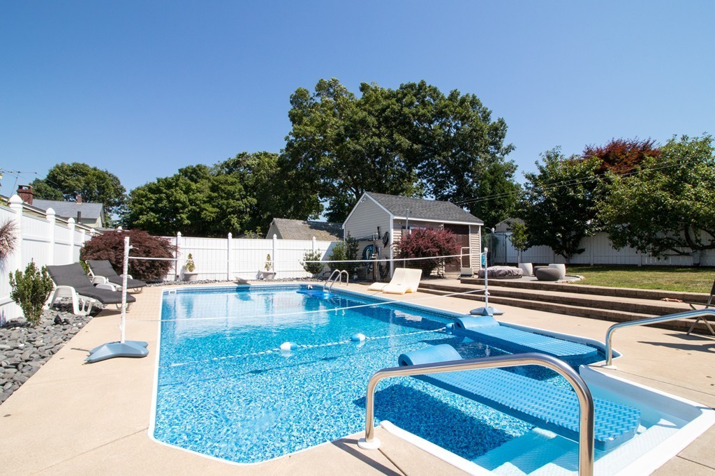 152 Carter Street Fall River, MA 02721 - Photo 26 of 30 a swimming pool with outdoor seating and yard