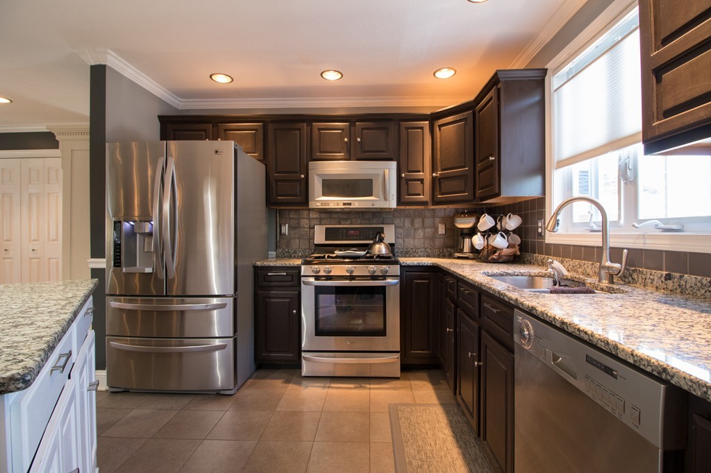 152 Carter Street Fall River, MA 02721 - Photo 6 of 30 a kitchen with stainless steel appliances granite countertop a refrigerator a stove and a sink