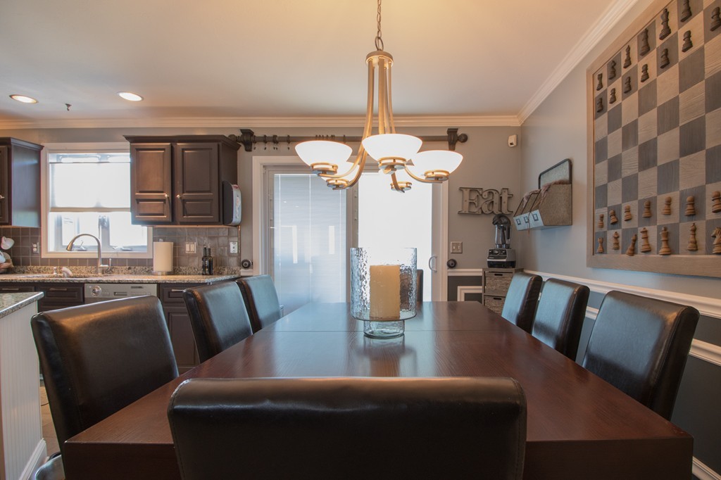 152 Carter Street Fall River, MA 02721 - Photo 7 of 30 a dining room with furniture and a chandelier