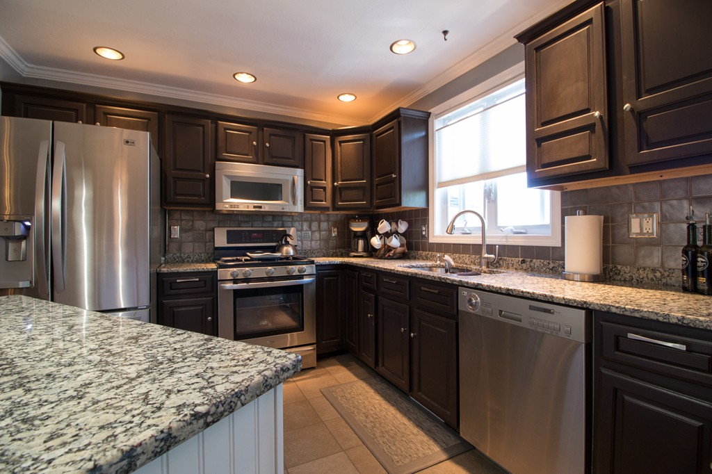 152 Carter Street Fall River, MA 02721 - Photo 9 of 30 a kitchen with stainless steel appliances granite countertop a stove refrigerator sink and microwave