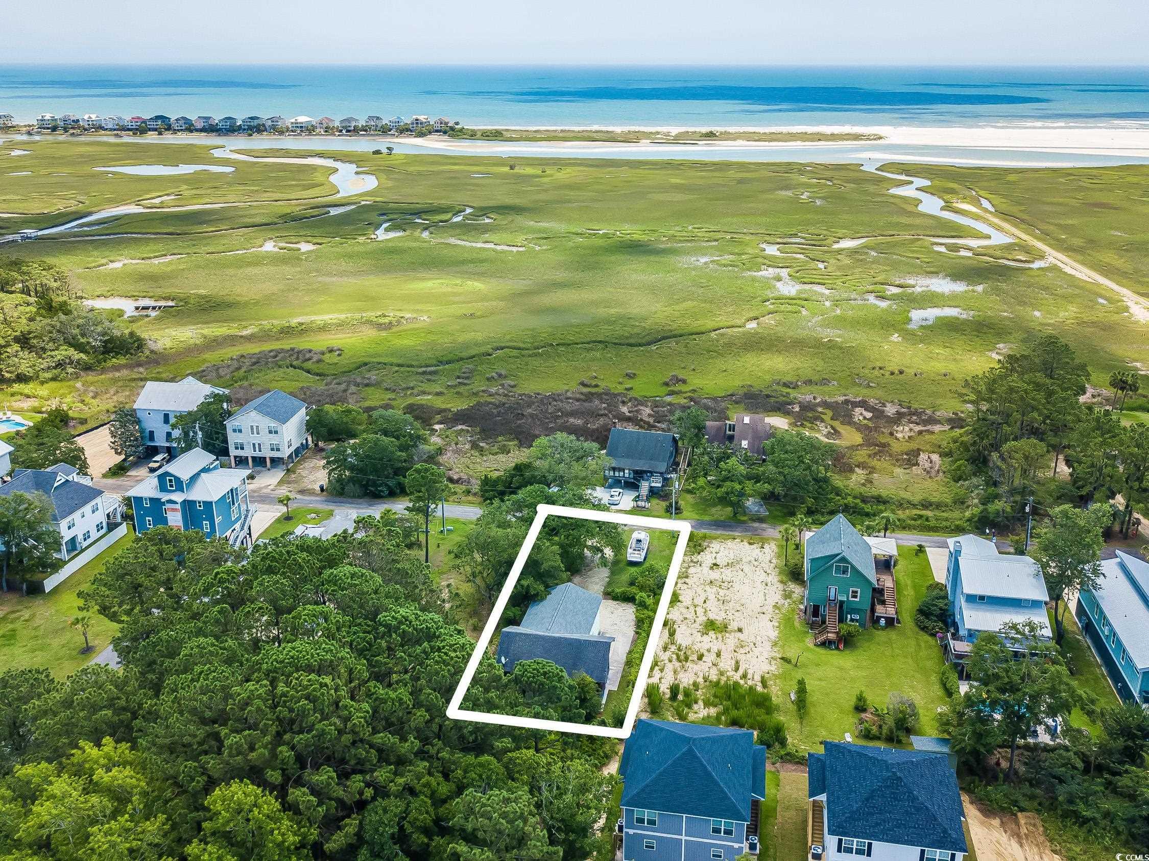 127 Brown Pelican Loop Pawleys Island, SC 29585 - Photo 28 of 31 Aerial view of property's location featuring a nearby body of water, a golf club, and property boundaries highlighted