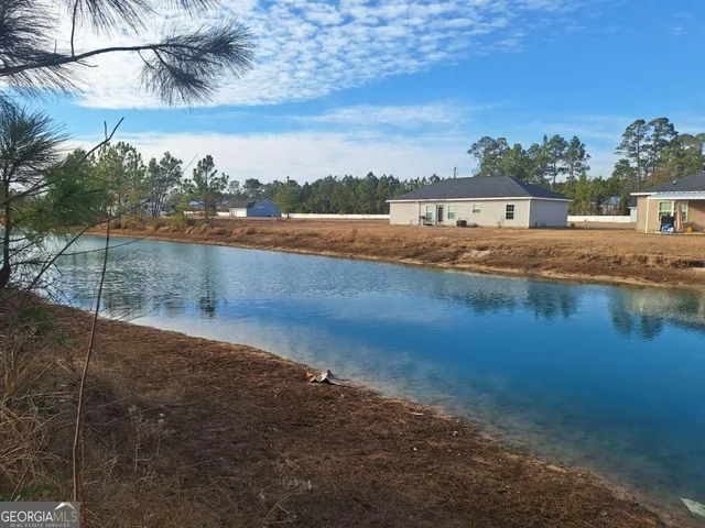 a view of a lake with a big yard