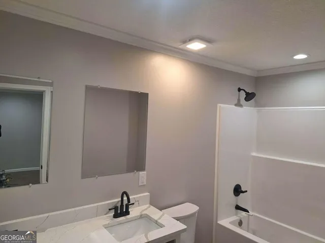 a bathroom with a bathtub and a sink