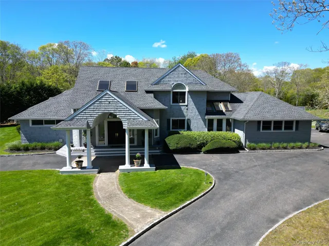 a view of a house with pool garden and patio