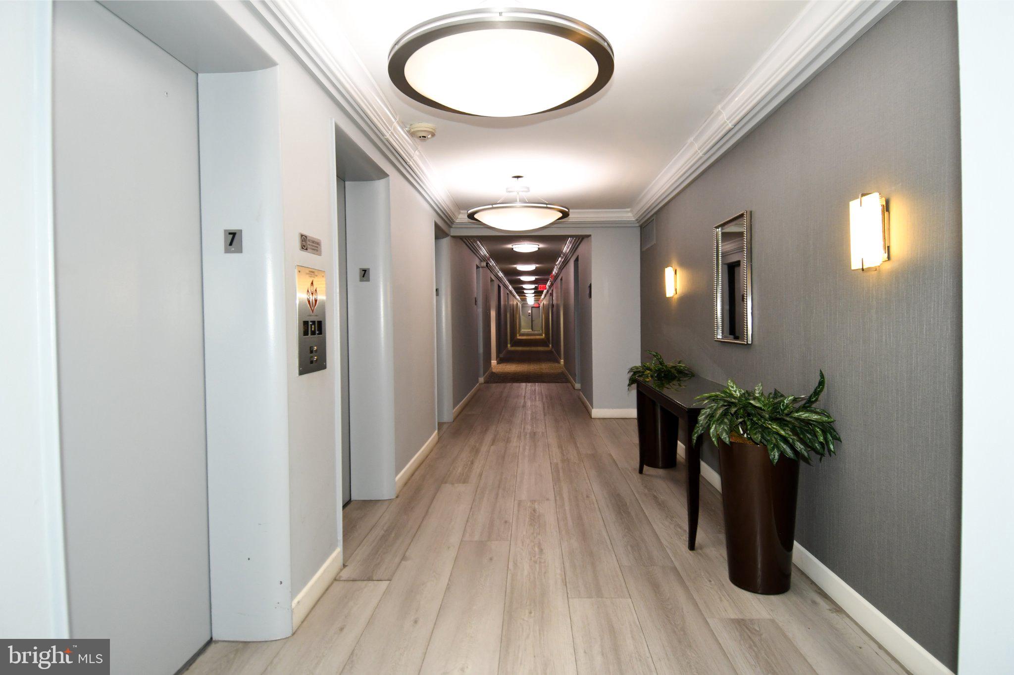 5101 River Road, Unit 712 Bethesda, MD 20816 - Photo 25 of 38 Modern corridor with elegant lighting.