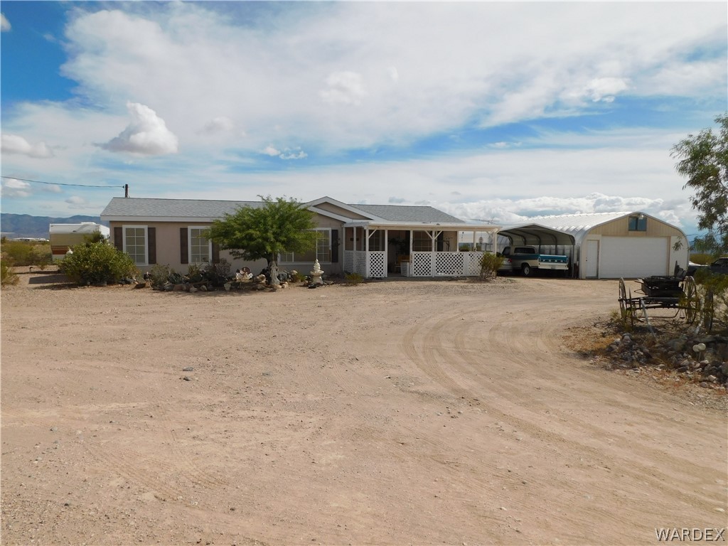 4810 Eloy Road Golden Valley, AZ 86413 - Photo 1 of 35 a view of residential houses with yard and mountain view