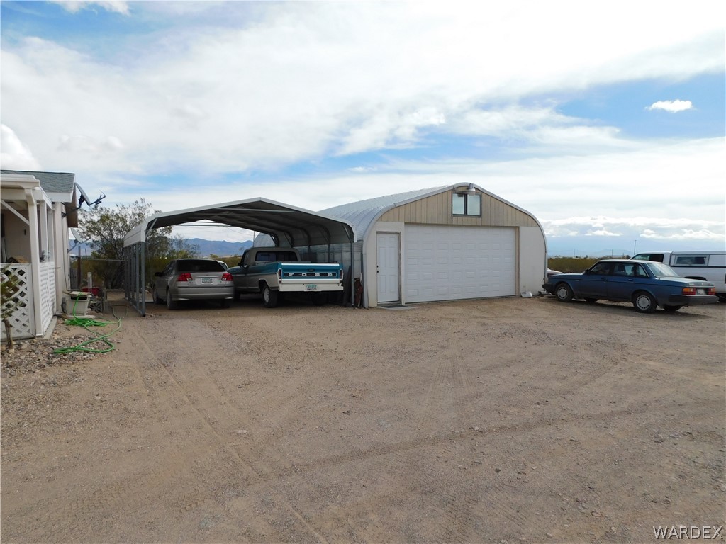 4810 Eloy Road Golden Valley, AZ 86413 - Photo 3 of 35 a car parked in front of a house