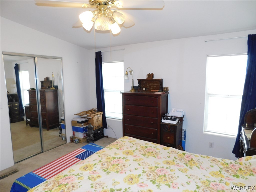 4810 Eloy Road Golden Valley, AZ 86413 - Photo 31 of 35 a bedroom with a bed and wooden floor