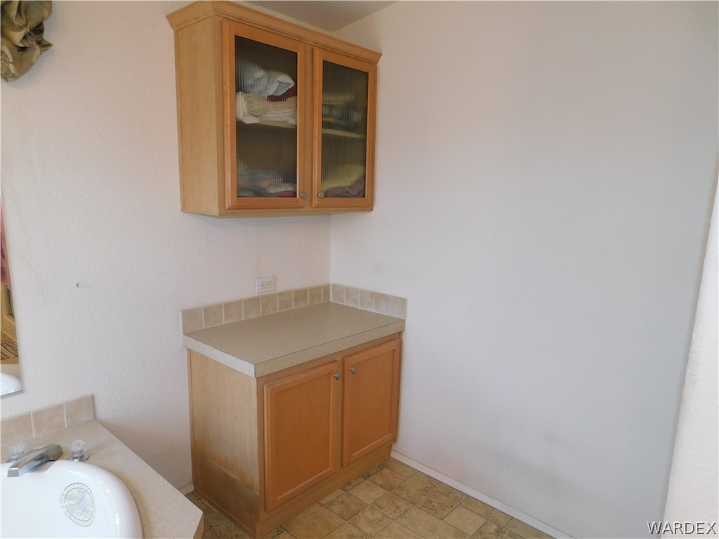 4810 Eloy Road Golden Valley, AZ 86413 - Photo 34 of 35 a utility room with a sink dryer and washer