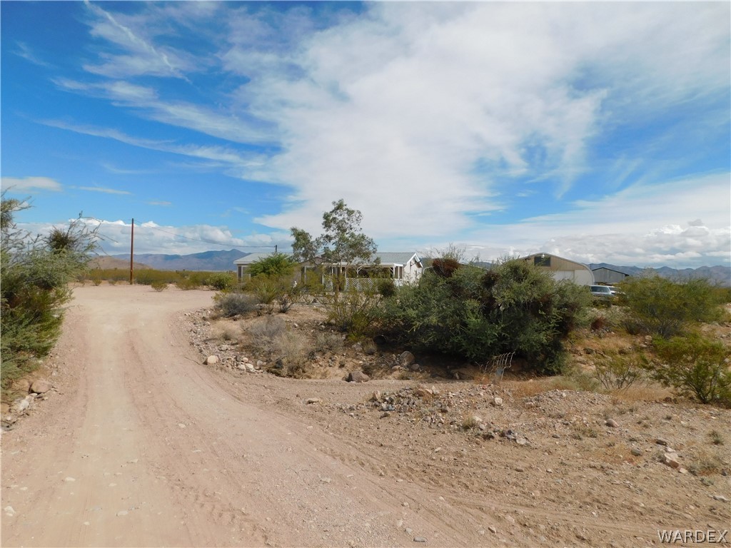 4810 Eloy Road Golden Valley, AZ 86413 - Photo 5 of 35 a view of a road with a yard