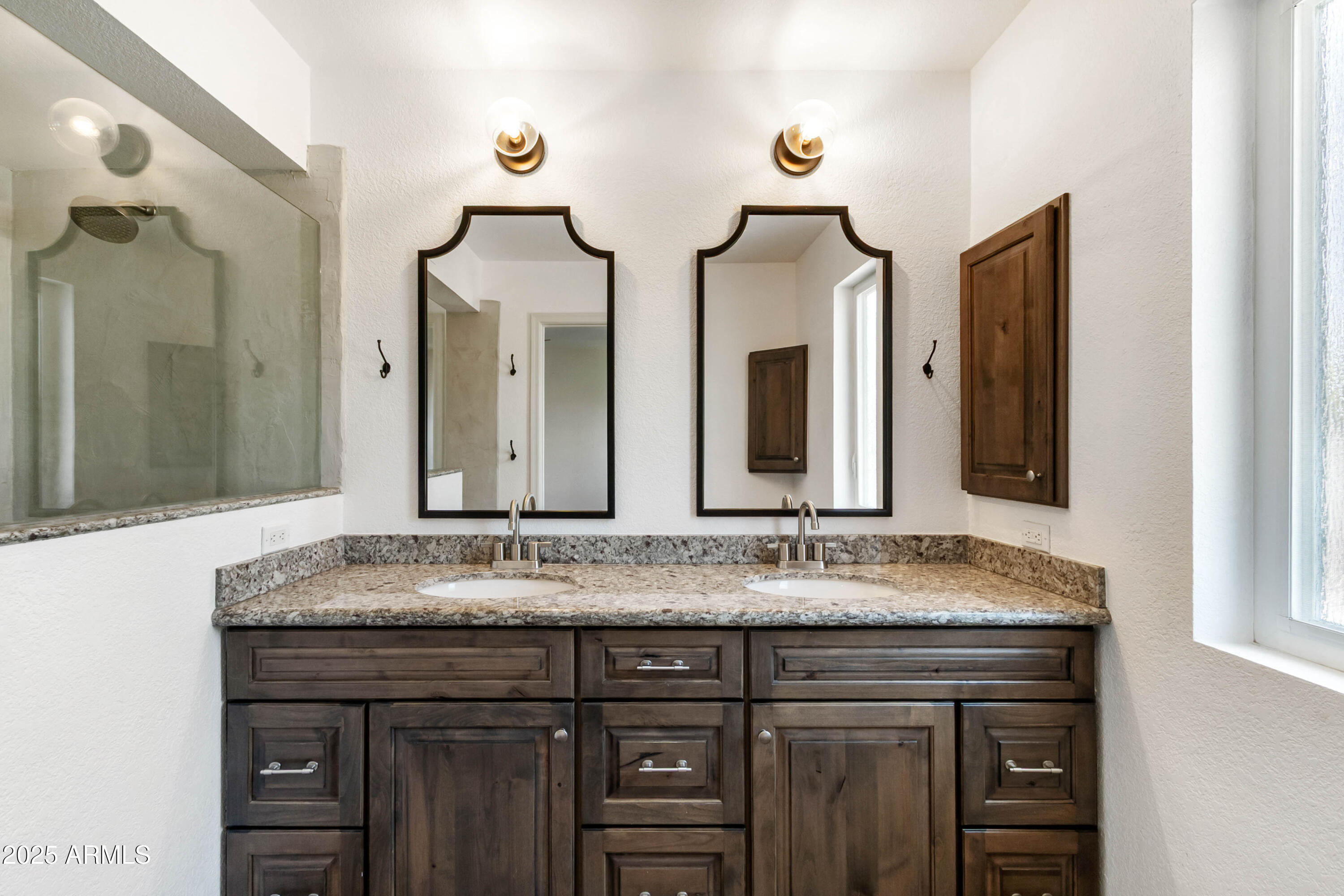 2228 East Jaeger Street Mesa, AZ 85213 - Photo 18 of 35 a bathroom with a granite countertop sink and a mirror