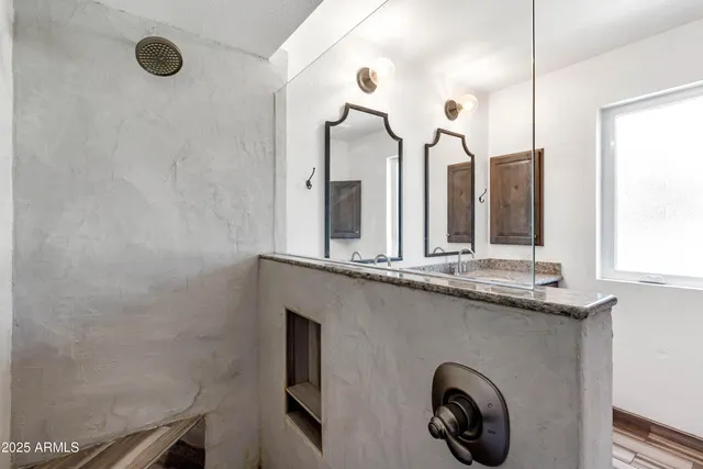 a bathroom with a sink and a mirror