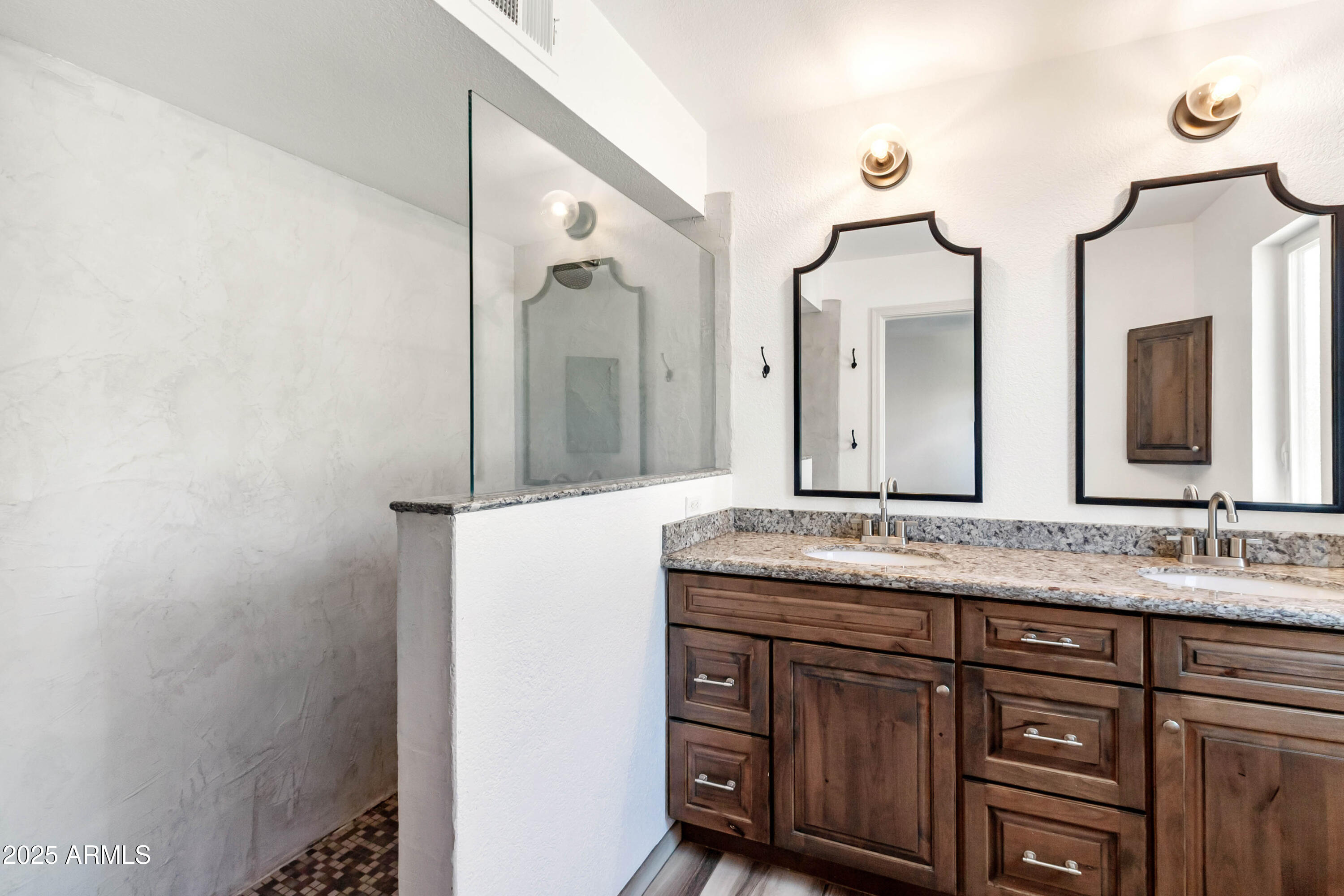 2228 East Jaeger Street Mesa, AZ 85213 - Photo 20 of 35 a bathroom with a granite countertop sink and a mirror