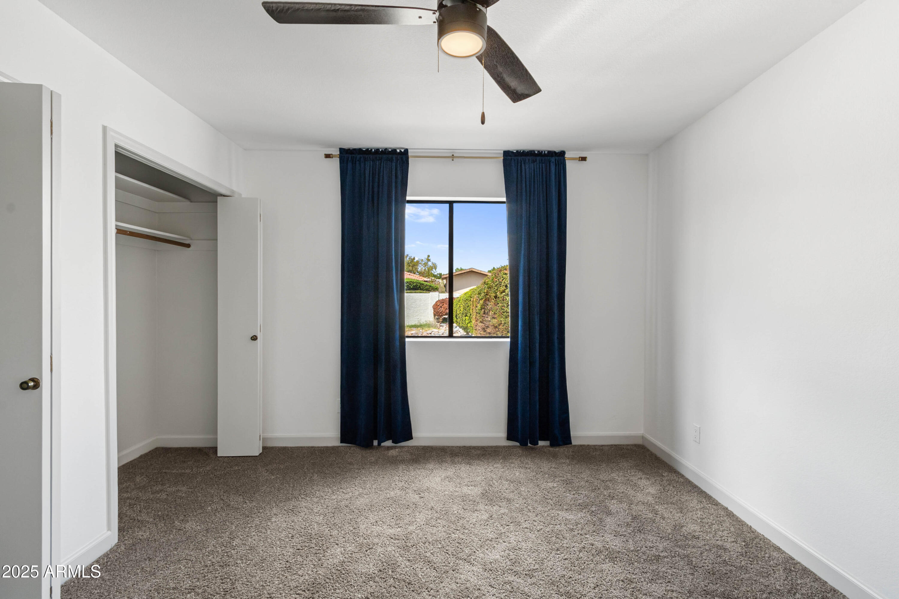 2228 East Jaeger Street Mesa, AZ 85213 - Photo 29 of 35 an empty room with closet and windows