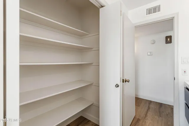 a view of an empty walk in closet