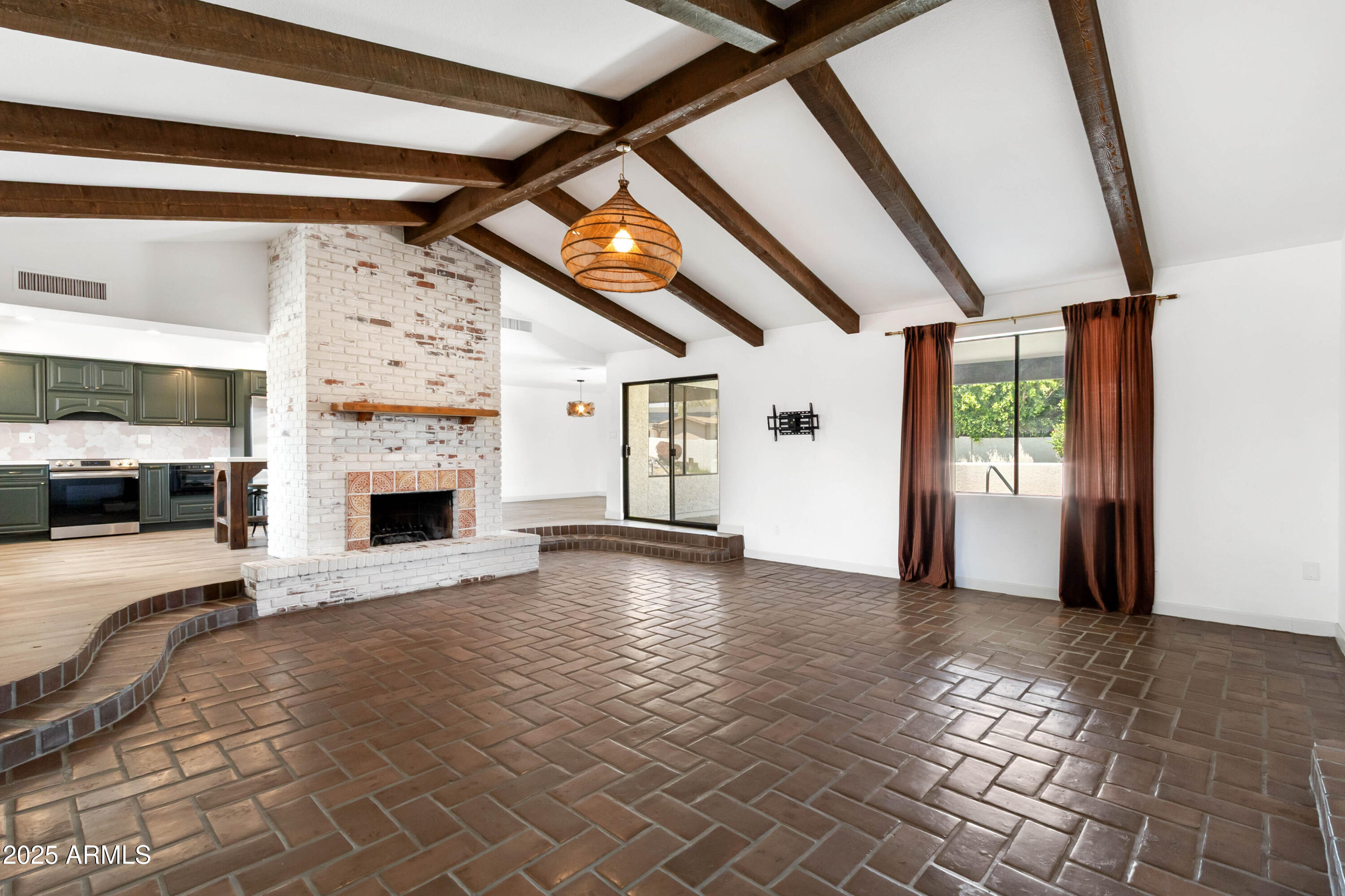 2228 East Jaeger Street Mesa, AZ 85213 - Photo 4 of 35 a view of empty room with fireplace and window