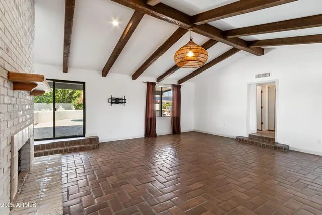 a view of an empty room with windows