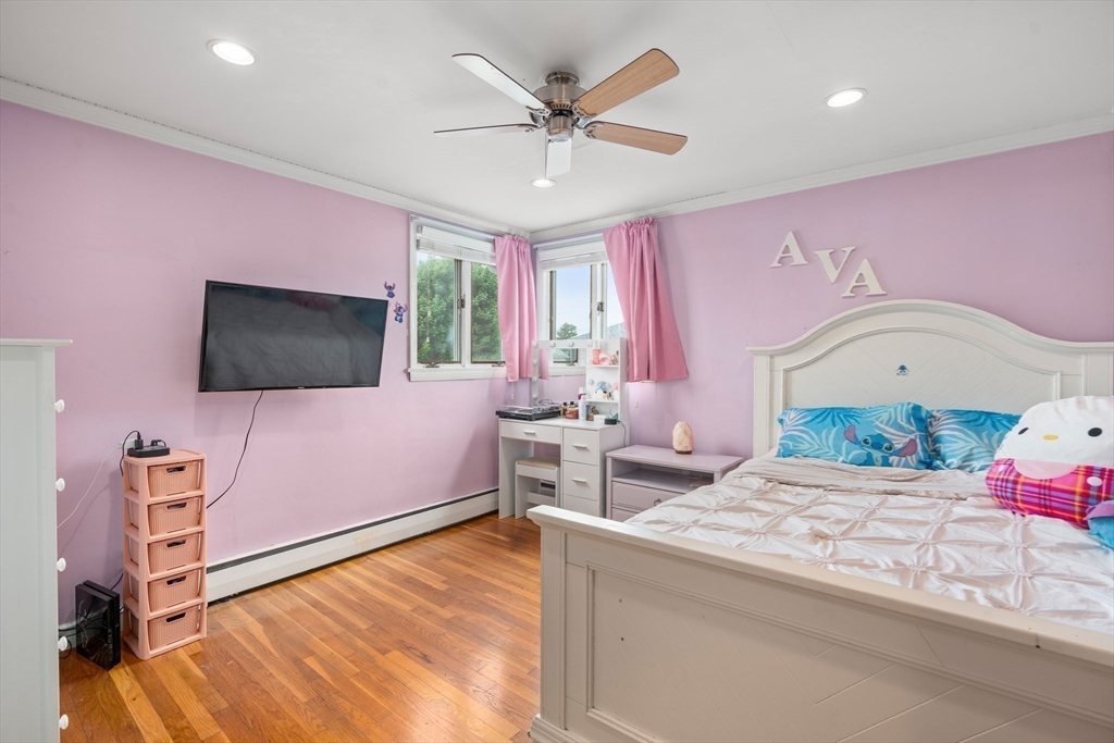 292 Rumney Road Revere, MA 02151 - Photo 13 of 24 a bedroom with a bed and a flat screen tv