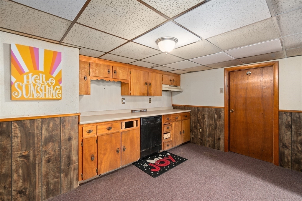 292 Rumney Road Revere, MA 02151 - Photo 15 of 24 a kitchen with stainless steel appliances granite countertop a sink stove and refrigerator