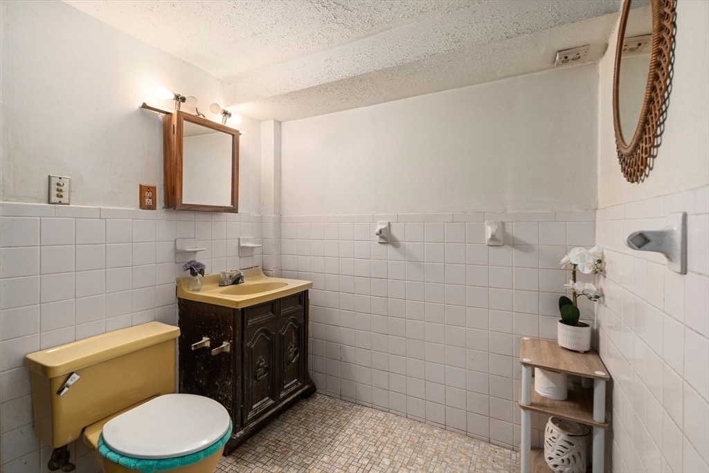 292 Rumney Road Revere, MA 02151 - Photo 17 of 24 a bathroom with a sink toilet and shower