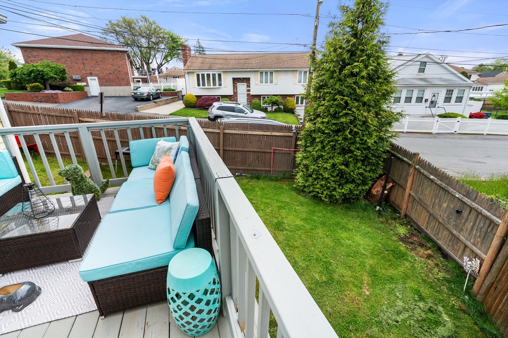 292 Rumney Road Revere, MA 02151 - Photo 23 of 24 a balcony with outdoor seating and yard