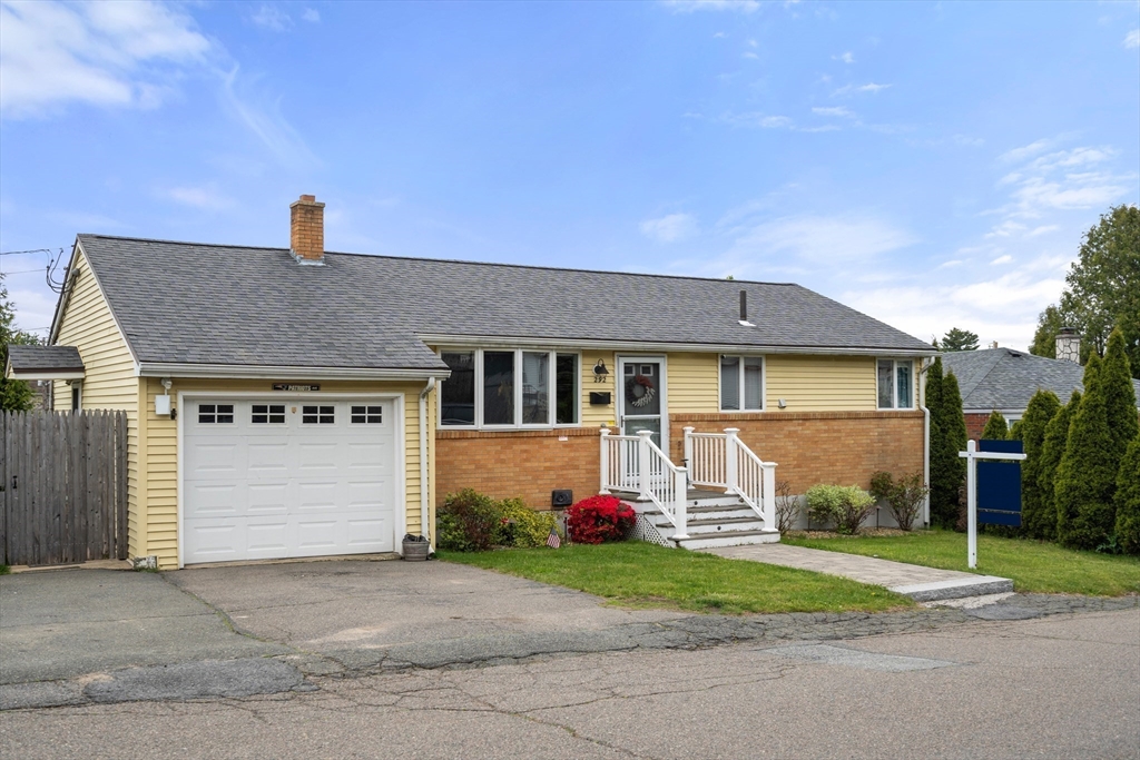 292 Rumney Road Revere, MA 02151 - Photo 3 of 24 a front view of a house with a yard and garage