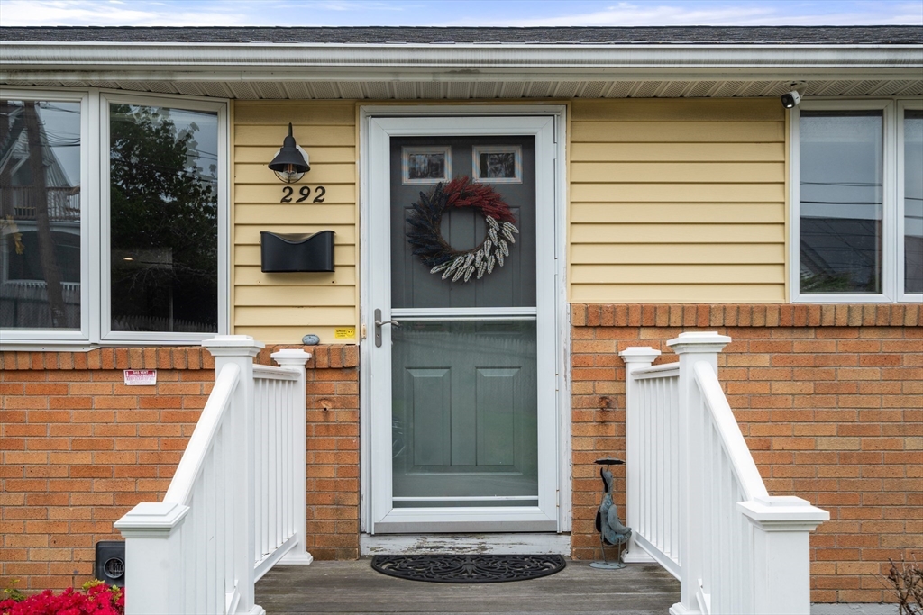292 Rumney Road Revere, MA 02151 - Photo 4 of 24 a view of a brick house with a large door