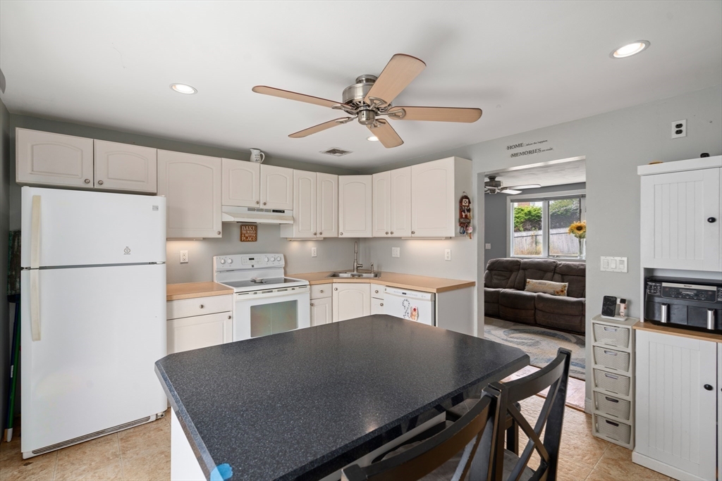 292 Rumney Road Revere, MA 02151 - Photo 9 of 24 a kitchen with refrigerator cabinets and wooden floor
